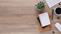 Top view wooden workspace office desk with computer and office supplies. Flat lay work table with blank notebook, keyboard, pen , Royalty Free Stock Photo