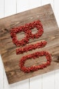 Top view of word bio made of goji berries on cutting board Royalty Free Stock Photo