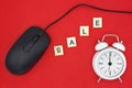 word SALE on a red background, white alarm clock and a black mouse Royalty Free Stock Photo