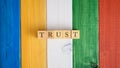 Top view of the word Trust spelled on wooden cubes Royalty Free Stock Photo