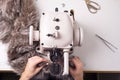 Top view of the work of a professional fur fabricator. Designer workplace sewing machine Royalty Free Stock Photo