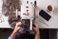 Top view of the work of a professional fur fabricator. Designer workplace sewing machine Royalty Free Stock Photo