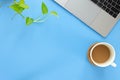 Top view of Work space desk with a laptop, notebook, coffee cup, post-it on a white table with copy space Royalty Free Stock Photo