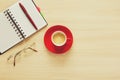 Top view on work table. Coffee cup, glasses, notes and pen Royalty Free Stock Photo