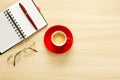 Top view on work table. Coffee cup, tablet, glasses, notes and pen Royalty Free Stock Photo