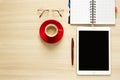 Top view on work table. Coffee cup, tablet, glasses Royalty Free Stock Photo