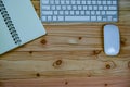 top view of working desk table with keyboard, mouse, notebook Royalty Free Stock Photo