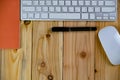 top view of working desk table with keyboard, mouse, notebook