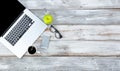 Top view of working desktop and smart phone, coffee, reading glasses and green apple with plenty of copy space Royalty Free Stock Photo