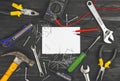 Top view on working hand tools,wrench, screwdriver, pliers, hammer, adjustable spanner, office knife, scattered nails and screws. Royalty Free Stock Photo