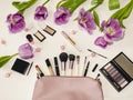 Handbag with cosmetics and flowers