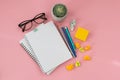 Top view of the workplace, stationery and notepads on a pink background. Conceptual ideas for inspiration. Place for your text and Royalty Free Stock Photo