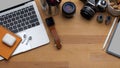 Workspace with digital devices, camera, accessories and copy space on wooden table Royalty Free Stock Photo