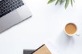 Top view workspace ,laptop on white table with coffee cup and notebook