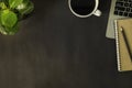 Top view of Workspace office desk, Dark black top table with laptop notebook, pencil and white cup of black coffee. Flat lay Royalty Free Stock Photo