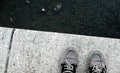 Top view of worn-out shoes of a man on the ground Royalty Free Stock Photo