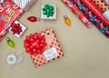 Top view of wrapped Christmas present with wrapping supplies Royalty Free Stock Photo