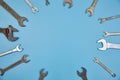 Top view wrenches on a blue background with space for text