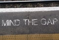 Top view of the "mind the gap" sign on the ground at the London railway station Royalty Free Stock Photo