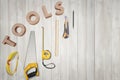 Top view of yellow construction instruments and tools on the white wooden table Royalty Free Stock Photo