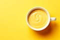 top view of a yellow cup with yellow coffee in it Royalty Free Stock Photo