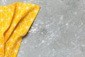 top view with yellow empty kitchen napkin isolated on table background. Folded cloth for mockup with copy space, Flat Royalty Free Stock Photo