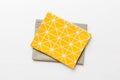 top view with yellow empty kitchen napkin isolated on table background. Folded cloth for mockup with copy space, Flat Royalty Free Stock Photo