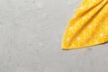 top view with yellow empty kitchen napkin isolated on table background. Folded cloth for mockup with copy space, Flat Royalty Free Stock Photo