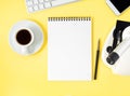 Top view of yellow office desktop with microscope, notepad, computer, smartphone. Mock up, empty space, science template