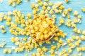 Top view yellow popcorn on blue wooden plank background Royalty Free Stock Photo