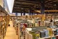 Top view of young Arab woman between bookshelves full of books