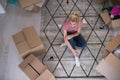 Top view of young beautiful woman sitting on the floor Royalty Free Stock Photo