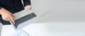 Top view of young businessman in suit carry and using laptop. Pressing Enter button in keyboard Royalty Free Stock Photo