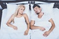 Top View of Young Couple Sleeping in Bed at Home Royalty Free Stock Photo