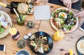 Top view of young friends eating lunch in bar restaurant Royalty Free Stock Photo