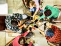 Top view of young friends using mobile smartphones in trendy pub bar brewery - Technology addicted people enjoying appetizer night Royalty Free Stock Photo