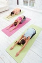 Top view of young girls stretching in gym