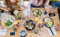 Top view of young people eating brunch and drinking smoothie bowl at vintage bar - Students having a lunch and chatting in trendy