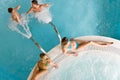 Top view - young people relax in swimming pool