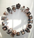 top view. young people shaking hands at a round table meeting Royalty Free Stock Photo