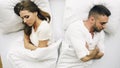 Top view of young upset couple lying in bed have problems after quarrel and angry each other at home Royalty Free Stock Photo