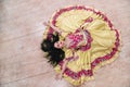 Top view. young woman in a beautiful dress singing a passionate Gypsy dance