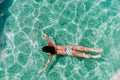 Top view of young woman diving underwater in a pool. summer and fun lifestyle Royalty Free Stock Photo