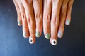 Top view of a young woman hand with a beautiful manicure on color background.