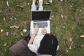 Top view of a young woman holding laptop computer on her lap Royalty Free Stock Photo