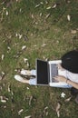 Top view of a young woman holding laptop computer on her lap Royalty Free Stock Photo