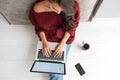 Top view of a young woman holding laptop computer Royalty Free Stock Photo