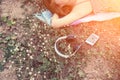 top view of young woman lying nearing headphone in the flower field Royalty Free Stock Photo