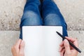 Top view of young woman making notes in notebook Royalty Free Stock Photo