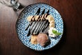 Top view, yummy desserts, a brownie, fresh slice banana, whipped cream and chocolate ice-cream topped with chocolate sauce Royalty Free Stock Photo